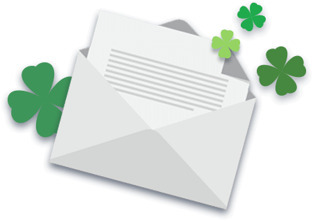 Newsletter and envelope, surrounded by 4 leaf clovers